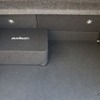 パワードサブウーファーはオーディソンのAPBX10AS2。振動板を下向きセットできるので荷物積載時も気を使うことがない。