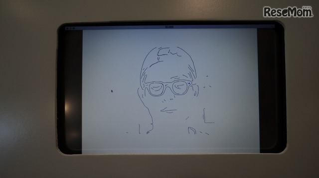 ロボットアームが描いた似顔絵（デンソー）